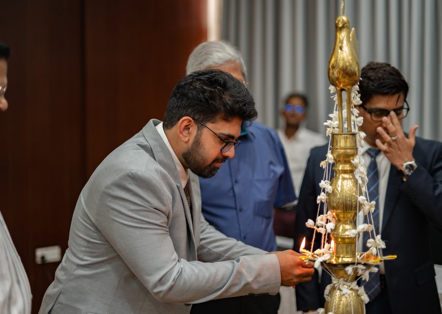Dr Sithira Senevirathne lighting the traditional oil lamp to open the launch